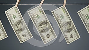 Dollars drying on clothesline rope