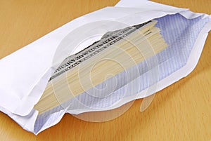 Dollars in an envelope