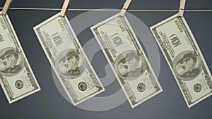 Dollars hanging on clothesline rope