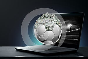 Dollars are inside the soccer ball, the ball is full of money. Sports betting, soccer betting, gambling, bookmaker, big win