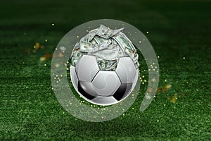 Dollars are inside the soccer ball, the ball is full of money. Sports betting, soccer betting, gambling, bookmaker, big win photo