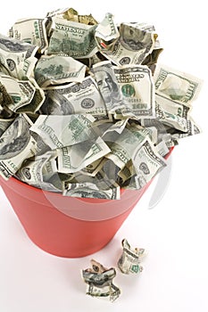 Dollars in Red Garbage Can