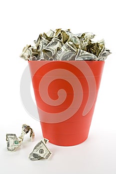 Dollars in Red Garbage Can