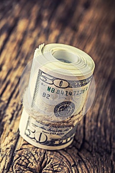 Dollars rolled banknotes closeup. Cash Money American Dollars.Close-up view of stack of US dollars