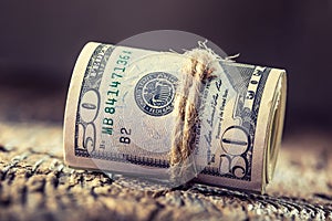 Dollars rolled banknotes closeup. Cash Money American Dollars.Close-up view of stack of US dollars