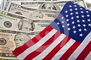 Dollars and the US flag as a background