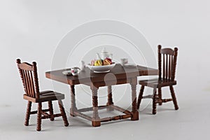 dollhouse interior - served tea table isolated on gray background