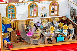 Dollhouse with teddies for sale on a flea market stall