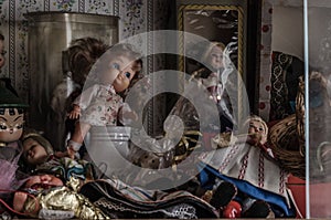 dolls and vitrine in abandoned house