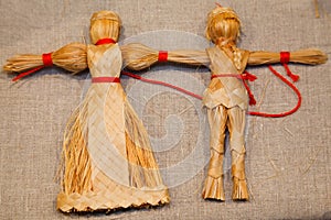 Dolls weaved from straw. Russian national souvenir photo