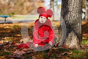 Dolly pin-up toothsome young girl wearing red blushful winter jacket and warm hat with boots fashion stylish clothes posing in aut