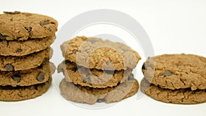 Dolly of rows chocolate chip cookies on white background