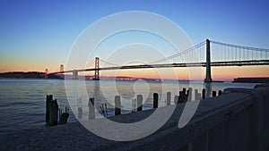 Dolly shot of the Bay Bridge at sunset in San Francisco, California