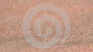 Dolly shot close up detailed towel texture. Continuous circular elastic weave material.