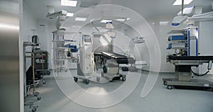 Dolly shot of modern operating room with advanced equipment for surgery