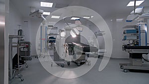 Dolly shot of modern operating room with advanced equipment for surgery