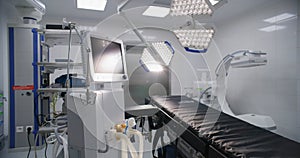 Dolly shot of operating room with advanced equipment for surgery