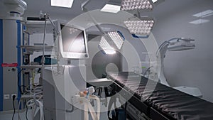 Dolly shot of operating room with advanced equipment for surgery