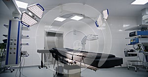 Dolly shot of operating room in modern hospital with advanced equipment