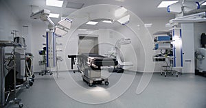 Dolly shot of operating room in modern hospital with advanced equipment