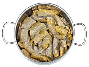 Dolma from vine leaves and mince in stewpan