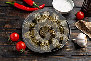 Dolma on a wooden rustic background. Traditional Caucasian, Turkish and Greek cuisine