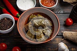 Dolma on a wooden rustic background. Traditional Caucasian, Turkish and Greek cuisine