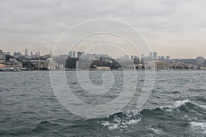 Dolmabahce Palace and Mosque in Istanbul, Turkey. View from Bosporus, Besiktas district photo