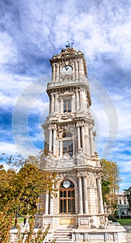 Dolmabahce Saat Kulesi in Istanbul. The clock tower is located at the entry of the Dolmabahce Palace