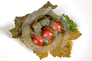 Dolmas (sarma, dolmadakia) on grape leaf photo