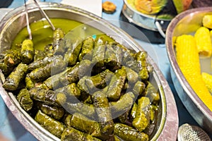 Dolmas Stuffed Grape Leaves -  filled with a mixture of rice, onions, meat and spices photo