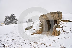 Dolmen Menga snowy of Antequera. Archaeological complex dolmens of Antequera