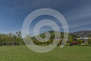 Dolni Becva village in spring color fresh green day with church and meadows