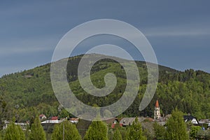 Dolni Becva village in spring color fresh green day with church and meadows