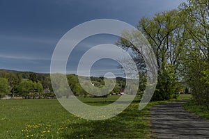 Dolni Becva village in spring color fresh green day with church and meadows