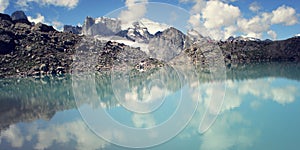 Dolomite Lake at Uzunkol, Caucasus Mountains. Bright blue alpine lake.