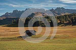 Dolomite mountain landscapes, Small loge on meadow on Alpe di Siusi, Dolomite Alps, Italy photo