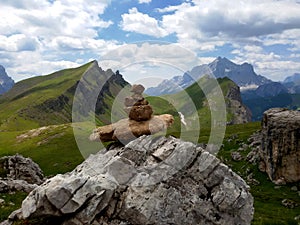 Dolomites mountain landscape with small pile of rocks, Cairns