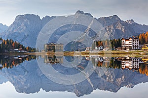 Dolomites mountains reflected in the Lago mi Misurina Lake at autumn, South Tyrol. Italy photo