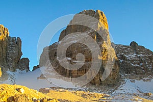 Dolomites rocky mountain wall in sunset light