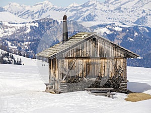 dolomites snow panorama wooden hut val badia armentarola hill