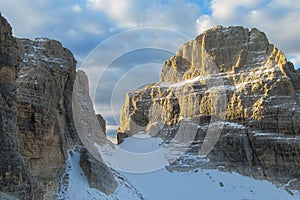 Rocky cliffs tower of Dolomites mountains above the pass, Dolomiti di Brenta