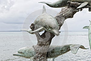 Dolphin copper statue