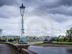 Dolphin lamp posts along the river Taw in Barnstaple, north Devon, UK.