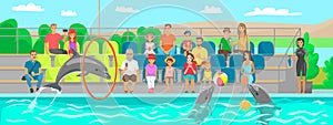 Dolphin is showing trick, jumping through hoop, performing in dolphinarium for spectators