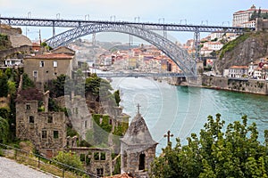 Dom Luis Bridge and Porto Oporto downtown viewed from romantic church ruins