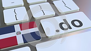 Domain .do and flag of the Dominican Republic on the buttons on the computer keyboard. National internet related 3D