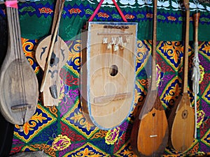 Dombra string instruments on the wall of Kazakh yurt
