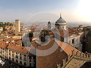 The dome of the cathedral in Bergamo showing the golden statue of Saint Alexander on