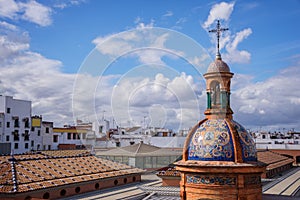 The dome of the chapel El Carmen and the roofs of Seville